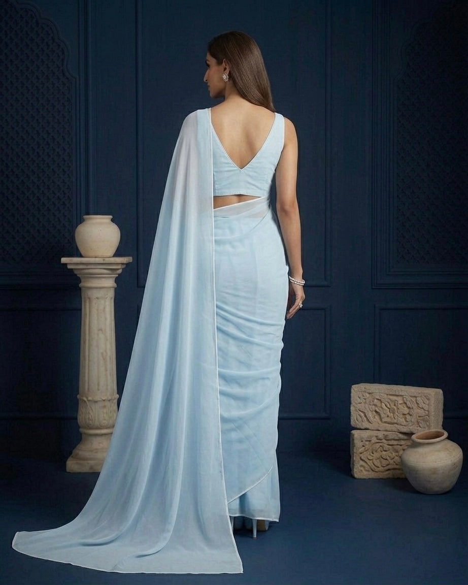 Ela: Pastel Blue Heavy Georgette Saree with White Piping