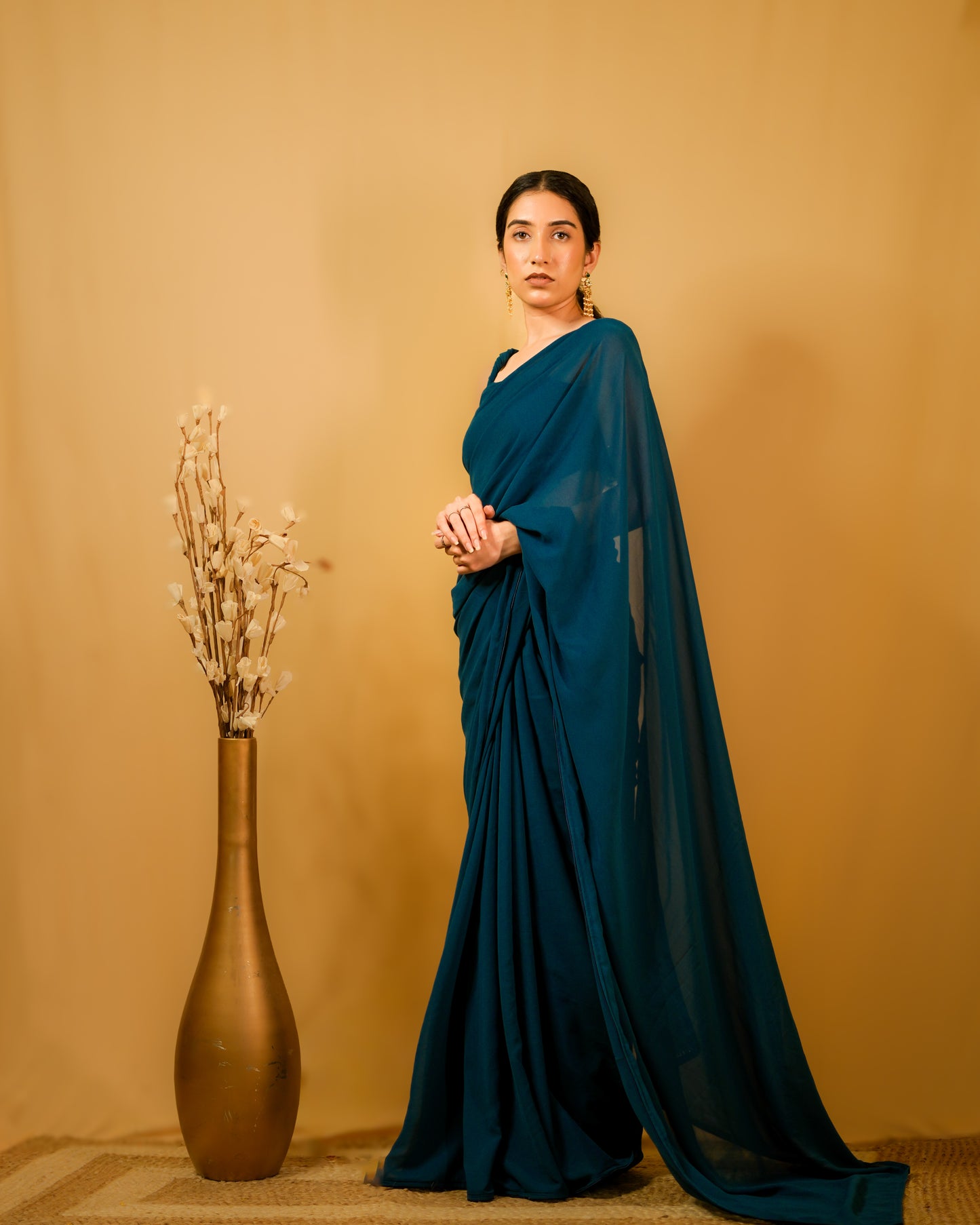 Neelkamal: Teal Blue Heavy Georgette Saree with Piping