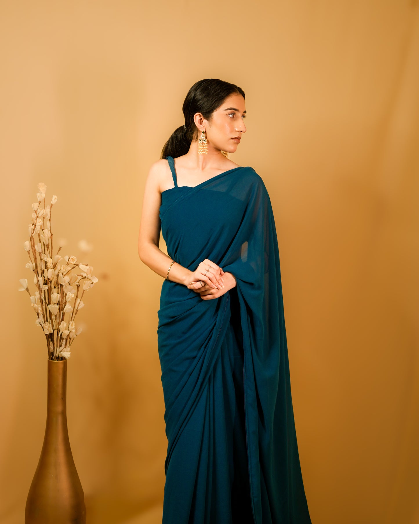 Neelkamal: Teal Blue Heavy Georgette Saree with Piping