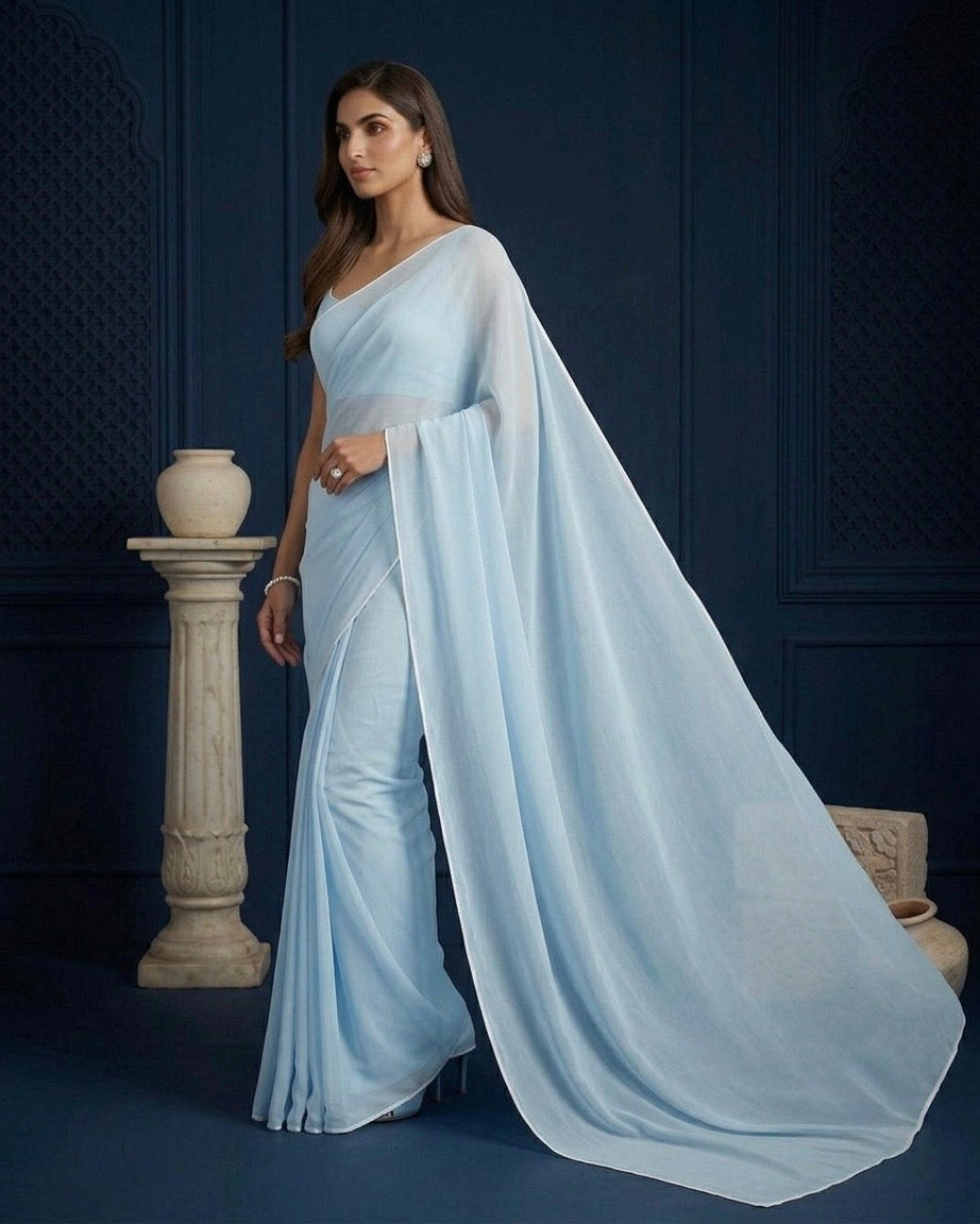 Ela: Pastel Blue Heavy Georgette Saree with White Piping