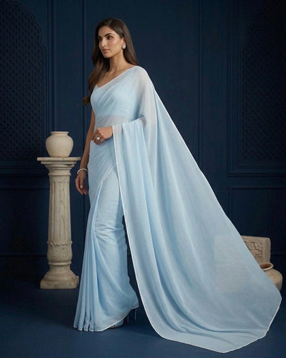 Ela: Pastel Blue Heavy Georgette Saree with White Piping