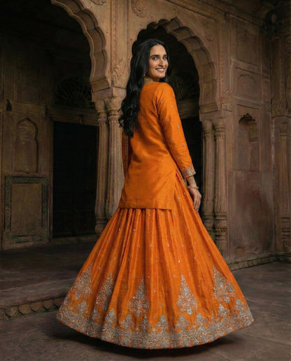 Hoor: Bright Orange Emboidered Kurta and Skirt Set by Velltiska