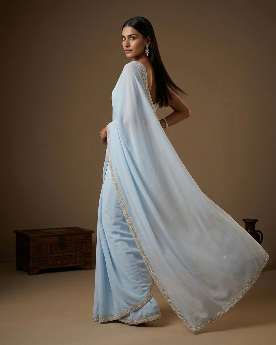 Lavanya: Pastel Blue Heavy Georgette Saree with Golden Lace