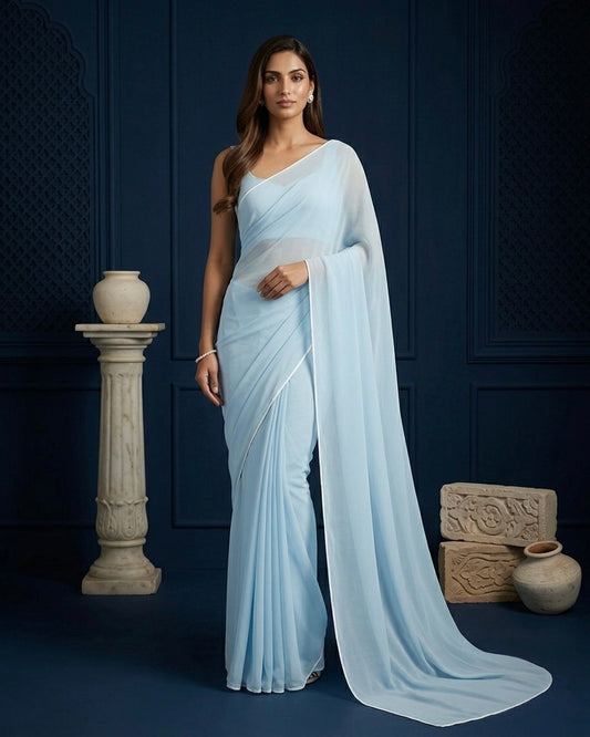 Ela: Pastel Blue Heavy Georgette Saree with White Piping