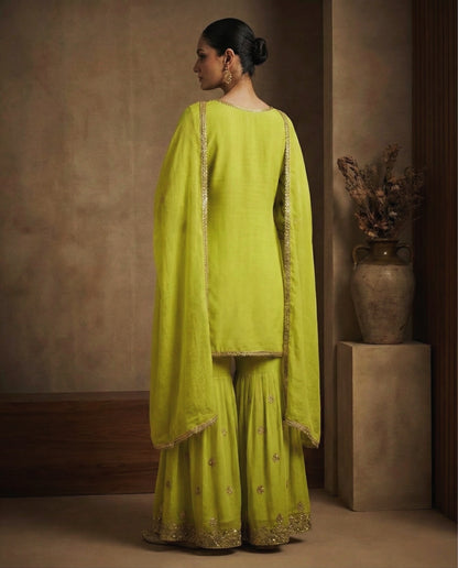 Ravya: Lime Green Embroidered Sharara Set by Velltiska