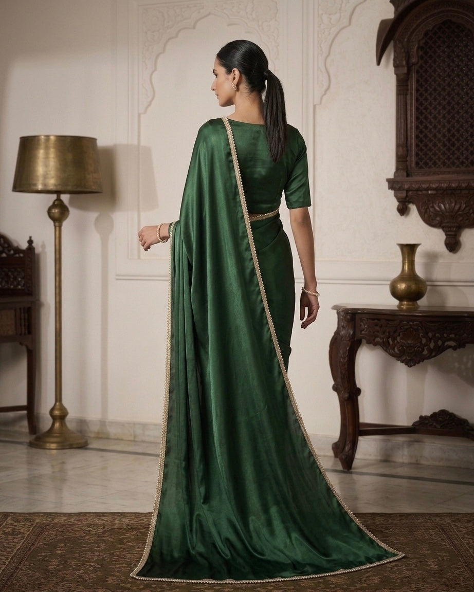 Naazni: Emerald Green Pre Draped Saree by Velltiska with Golden Lace