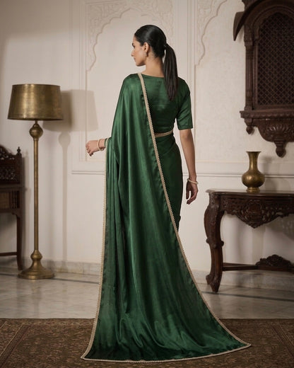 Naazni: Emerald Green Pre Draped Saree by Velltiska with Golden Lace
