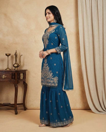 Aarohi: Teal Blue Embroidered Sharara Set by Velltiska