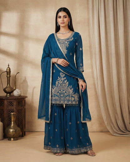 Aarohi: Teal Blue Embroidered Sharara Set by Velltiska