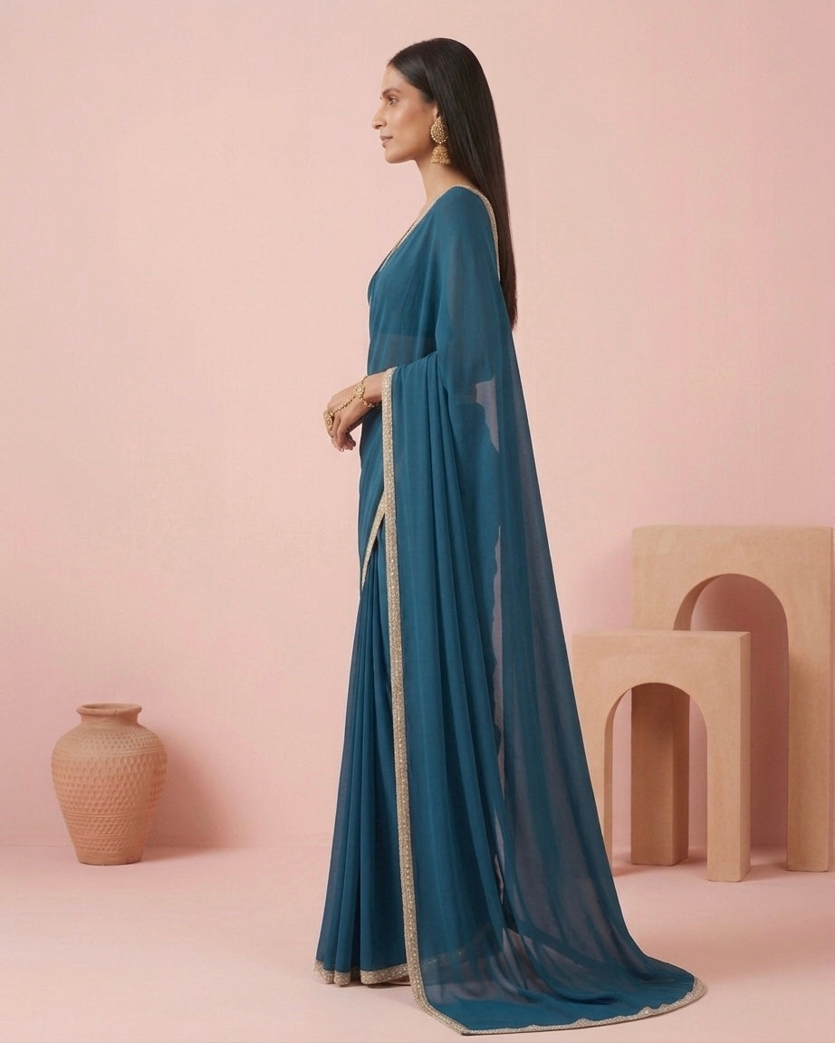 Tara: Teal Green Heavy Georgette Saree with Golden Lace