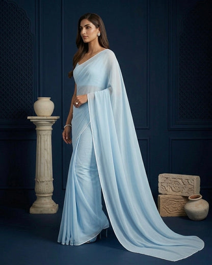 Ela: Pastel Blue Heavy Georgette Saree with White Piping