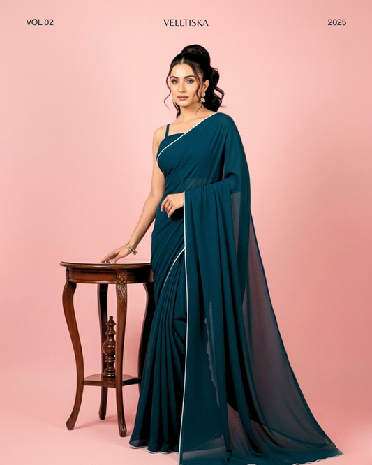 Neelkamal: Teal Blue Heavy Georgette Saree with White Piping Border