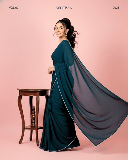 Neelkamal: Teal Blue Heavy Georgette Saree with White Piping