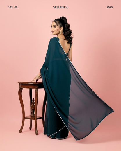 Neelkamal: Teal Blue Heavy Georgette Saree with White Piping