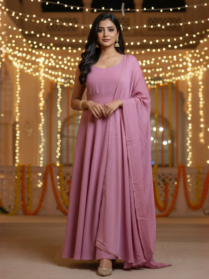Nazm: Muted Pink Solid Anarkali Gown by Velltiska with Dupatta and Sleeves