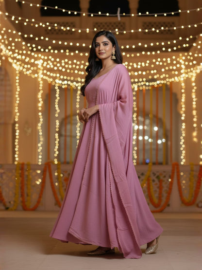 Nazm: Muted Pink Solid Anarkali Gown by Velltiska with Dupatta and Sleeves